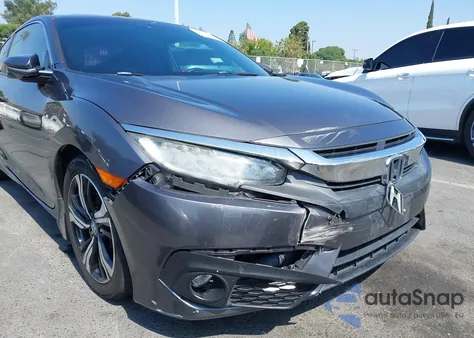 2016 Honda Civic Touring z USA, uszkodzony, nr VIN 2HGFC3B9XGH359765